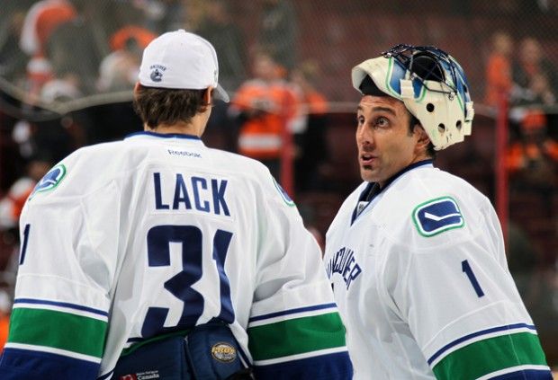 PHILADELPHIA, PA - OCTOBER 15:  Roberto Luongo #1 of the Vancouver Canucks talks to Eddie Lack #31 after defeating the Philadelphia Flyers 3-2 on October 15, 2013 at the Wells Fargo Center in Philadelphia, Pennsylvania.  (Photo by Len Redkoles/NHLI via Getty Images)