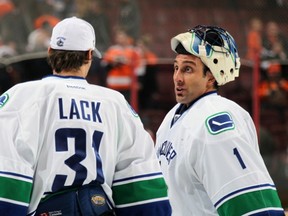 PHILADELPHIA, PA - OCTOBER 15:  Roberto Luongo #1 of the Vancouver Canucks talks to Eddie Lack #31 after defeating the Philadelphia Flyers 3-2 on October 15, 2013 at the Wells Fargo Center in Philadelphia, Pennsylvania.  (Photo by Len Redkoles/NHLI via Getty Images)