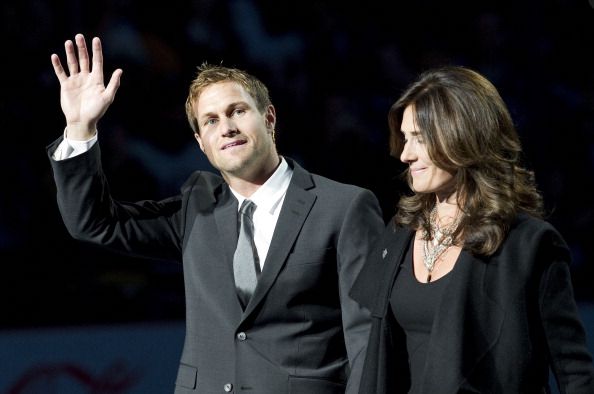 Markus Naslund and his wife Lotta wave to the crowd during a ceremony to retire his jersey on Dec. 11, 2010 at Rogers Arena. (Photo by Rich Lam/Getty Images)