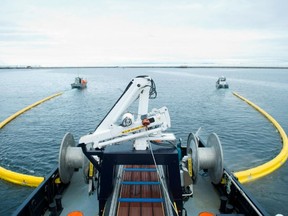 The vessell Burrard Cleaner No. 9 demonstrates how its booms surround oil spills so they can be cleaned up. (SUBMITTED PHOTO)