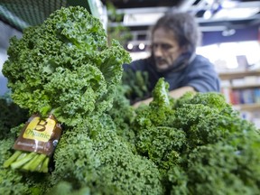 Produce manager Jeremy Blaine unloads California veggies at Eternal Abundance organic grocery store in Vancouver.