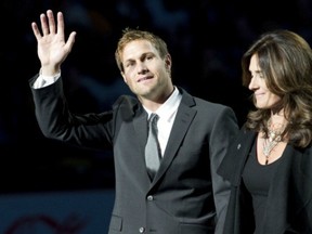 Former captain Markus Naslund, shown here with his wife Lotta when the Canucks retired his jersey in 2010, may be in the mix to re-join the NHL club in some capacity.
(Photo by Rich Lam/Getty Images)