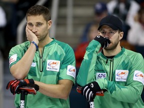 John Morris and Jim Cotter at the 2013 Roar of the Rings Olympic Curling Trials. (Photo by Trevor Hagan/Getty Images)