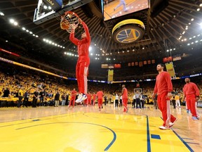 The Los Angeles Clippers warm up prior to the game against the Golden State Warriors in Game Four of the Western Conference Quarterfinals at Oracle Arena on April 27, 2014 in Oakland, California. (Photo by Noah Graham/NBAE via Getty Images)