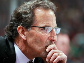 Canucks coach John Tortorella is going about his business behind the bench as rumours about his future swirl. (Jeff Vinnick/Getty Images)