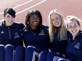 The Trinity Western Spartans, following a third-place national finish by it's women's team, have become contenders to win a CIS title. Helping lead the charge are (left to right) high jumper Emma Nuttall, long jumper Sabrina Nettey, middle-distance runner Sarah Inglis and cross country standout Alison Jackson. (Photo -- Scott Stewart, TWU athletics)