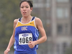 The rain at Dhillon Oval didn't slow UBC's Maria Bernard from winning the 5,000 metres at the 'Birds Invite. (Wilson Wong, UBC athletics)