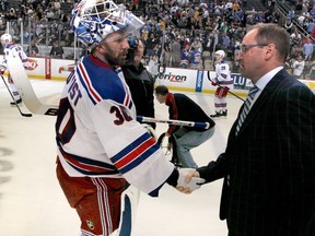 Penguins coach Dan Bylsma shakes hands with Rangers goaltender Henrik Lundqvist -- the man who may have cost him his job -- after Pittsburgh's Game 7 playoff loss on Tuesday.
 (Photo by Gregory Shamus/NHLI via Getty Images)