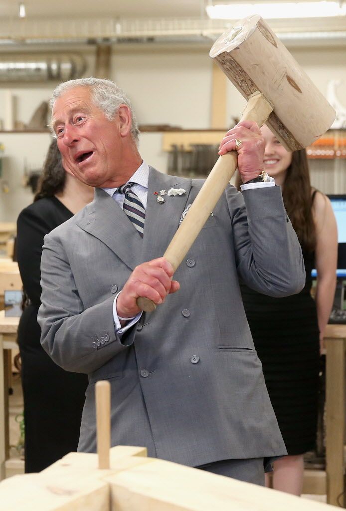 CHARLOTTETOWN, CANADA – MAY 20:  Prince Charles, Prince of Wales hammers in a peg with a giant mallet as he visits the woodwork department at the centre for applied science and technology at Holland College on May 20, 2014 in Charlottetown, Canada. The Prince of Wales and Duchess of Cornwall are on a four day visit to Canada.  (Photo by Chris Jackson/Getty Images)