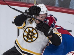 Boston Bruins' Brad Marchand is taken out by Montreal Canadiens' P.K. Subban during second period NHL playoff hockey action Thursday, May 8, 2014 in Montreal. THE CANADIAN PRESS/Paul Chiasson