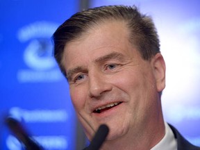 Jim Benning, new general manager of the Vancouver Canucks, hosts a news conference in Vancouver on Friday, May 23, 2014.