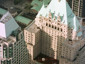 The oxidized copper-topped Hotel Vancouver plays host to the start of the Vancouver Sun Run in 1998. The iconic castle-like hotel built in 1939 is up for sale.