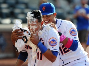 The New York Mets' Ruben Tejada and Juan Lagares on May 11, 2014. Getty Images photo.