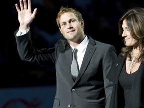 Markus Naslund, shown here with wife Lotta during his jersey retirement ceremony in 2010 at Rogers Arena, would be in interesting hire for the Canucks -- though both sides say nothing has been discussed at this point.
(Photo: Rich Lam/Getty)