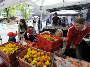 Vancouver shoppers enjoy the first Yaletown Market of the year on Thursday afternoon.