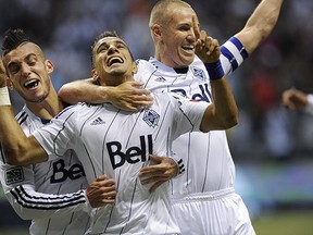 Don't underestimate the forgiveness in the Whitecaps' locker room for Camilo Sanvezzo (centre), as the MLS players all want to win. And with Kenny Miller (right) now gone, there is room for a designated player on the roster.