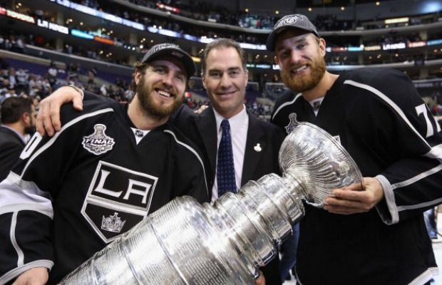 Kings assistant coach John Stevens, here with Mike Richards (left) and Jeff Carter after Los Angeles won the Stanley Cup in 2012, is a prime candidate to be the Canucks next head coach.  (Photo by Bruce Bennett/Getty Images)