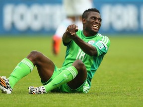 Michael Babatunde of Nigeria was in considerable pain after taking a teammate's shot in the wrist in Nigeria's 3-2 loss to France on Wednesday.  (Photo by Paul Gilham/Getty Images)