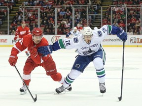 Frank Corrado tries to hold off Tomas Tatar of the Detroit Red Wings.