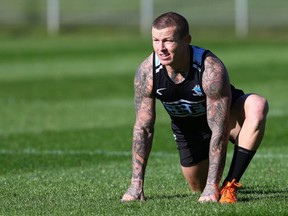 Todd Carney stretches during a Cronulla Sharks NRL training session at Remondis Stadium on May 14, 2014 in Sydney, Australia.  (Photo by Renee McKay/Getty Images)