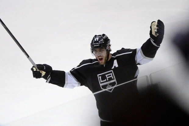 LOS ANGELES, CA - MAY 26:  Anze Kopitar #11 of the Los Angeles Kings celebrates after teammate Drew Doughty #8 scores a second period goal against the Chicago Blackhawks in Game Four of the Western Conference Final during the 2014 Stanley Cup Playoffs at Staples Center on May 26, 2014 in Los Angeles, California.  (Photo by Harry How/Getty Images) ORG XMIT: 492396931