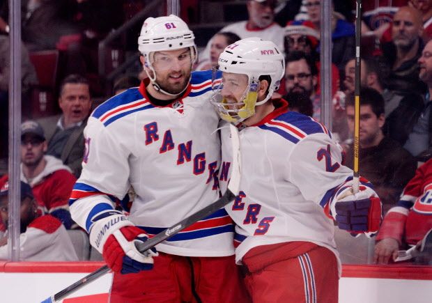 MONTREAL, QC - MAY 27: Derek Stepan #21 of the New York Rangers celebrates his first period goal with teammate Rick Nash #61 against the Montreal Canadiens during Game Five of the Eastern Conference Final in the 2014 NHL Stanley Cup Playoffs at Bell Centre on May 27, 2014 in Montreal, Canada.  (Photo by Richard Wolowicz/Getty Images) ORG XMIT: 492397049