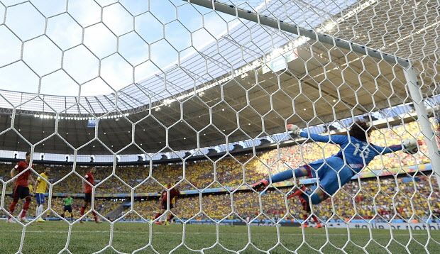 Mexico’s goalkeeper Guillermo Ochoa dives for the ball during a Group A football match between Brazil and Mexico in the Castelao Stadium in Fortaleza during the 2014 FIFA World Cup on June 17, 2014. YURI CORTEZ/AFP/Getty Images