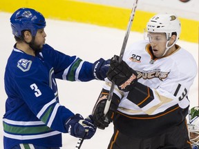 Kevin Bieksa tussles with Nick Bonino. Now they'll be teammates.