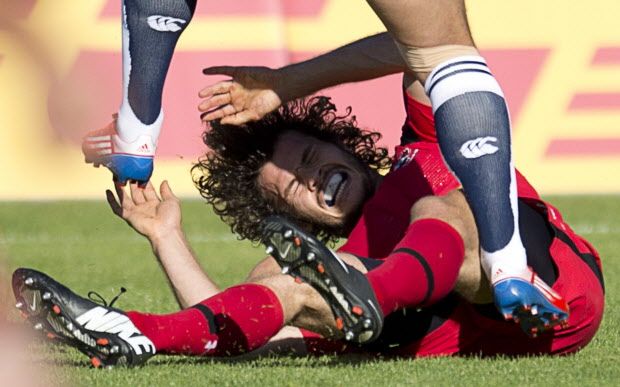 Taylor Paris gets pushed to the ground by Japan’s Ayumu Goromaru during their international rugby match at Swangard Stadium THE CANADIAN PRESS/Jonathan Hayward