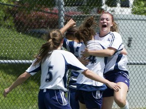 Members of Surrey's Fleetwood Park Dragons senior girls soccer team celebrate Natalie Morin's first-half goal in eventual 3-0 title-game win over South Delta. (Jenelle Schneider, PNG)