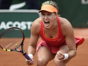 Allons-y! Eugenie Bouchard was fantastic, resilient in beating Spain's Carla Suarez Navarro in three sets Tuesday in the French Open quarterfinals. Getty Images photo.