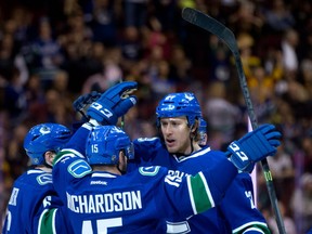 Shawn Matthias and the Canucks celebrate his goal in March against the Sabres.