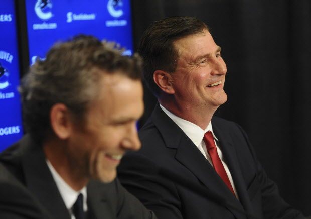 Jim Benning is introduced by team president Trevor Linden as the new general manager for the Vancouver Canucks in Vancouver, BC Friday, May 23, 2014.  (Photo by Jason Payne/ PNG)