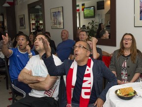 Italy fans watch with great anxiety as Italy plays Costa Rica in World Cup action at Caffe Bella Napoli on Commercial Drive Friday. Italy lost 1-0. VANCOUVER, June 20, 2014. (Jenelle Schneider/PNG staff photo)