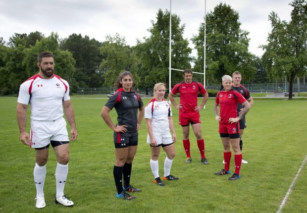 Members of Canada's men's and women's rugby teams wear their new uniforms at the team's practice facility in Burnaby, B.C. Tuesday, June, 3, 2014. THE CANADIAN PRESS/Jonathan Hayward ORG XMIT: JOHV108