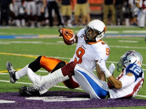 MONTREAL, QC - JULY 4:  Geoff Tisdale tackles Ernest Jackson during the CFL game at Percival Molson Stadium on July 5, 2014 in Montreal, Quebec, Canada.  (Photo by Richard Wolowicz/Getty Images)