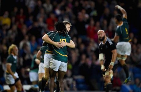 Mark Richards and Seabelo Senatla of South Africa celebrate after winning the gold medal match in the rugby sevens at Ibrox Stadium during day four of the Glasgow 2014 Commonwealth Games on July 27, 2014 in Glasgow, United Kingdom.  (Photo by Jeff J Mitchell/Getty Images)