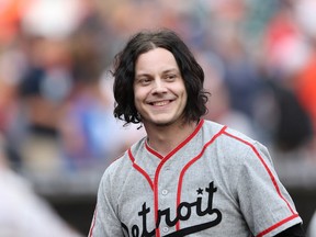 Musician and Detroit native Jack White gets ready to throw out the first pitch prior to the start of the game between the Chicago White Sox and the Detroit Tigers at Comerica Park on July 29, 2014 in Detroit, Michigan.  (Photo by Leon Halip/Getty Images)