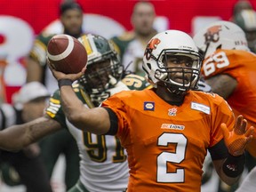JUNE 28 2014. BC Lions quarterback  Kevin Glenn winds up for a throw against Edmonton Eskimos in CFL action at BC Place  in  Vancouver, B.C.  on June 28, 2014.   (Steve Bosch  /  PNG staff photo) [PNG Merlin Archive]