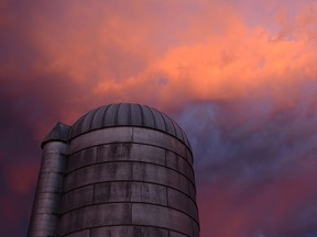 An old silo illuminated by a remarkable summer sunset in Abbotsford Sunday night.