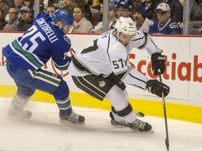 Vancouver Canucks Mike Santorelli, left chases Los Angeles Kings Linden Vey, right during the first period of a regular season NHL game at Rogers Arena in Vancouver Monday November 25, 2013.  (Ric Ernst / PNG)