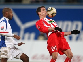 Julian Jenner, right, is reportedly a target for the Whitecaps. (Photo by Matthias Kern/Bongarts/Getty Images)