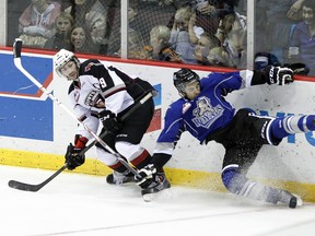 Giants forward Dalton Sward and Royals defenceman Travis Brown come together in a game last season. (Getty Images.)