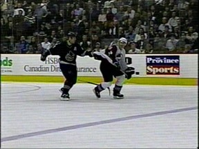Frame grab from Sportsnet TV, of Bertuzzi hitting Steve Moore from behind at a Vancouver Canucks and Colorado Avalanche hockey game on March 8th, 2004 .  Photo Credit: Sportsnet TV.  [PNG Merlin Archive]