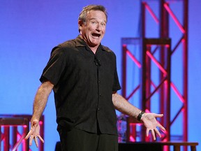 This Nov. 23, 2009 photo released by Starpix shows actor-comedian Robin Williams performing his stand-up show, “Weapons of Self Destruction,” at Town Hall in New York.