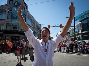 Justin Trudeau, here waving to the crowd during the Vancouver Pride Parade, leads the federal Liberal Party, which has seen a surge in membership and polling numbers leading into the 2015 election year.