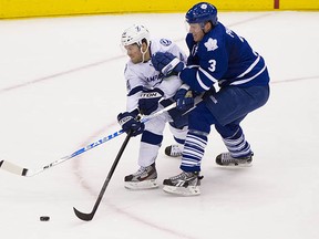 JT Wyman battles Dion Phaneuf of the Toronto Maple Leafs during a 2012 game as a member of the Tampa Bay Lightning. He's been given a professional tryout by the Vancouver Canucks.