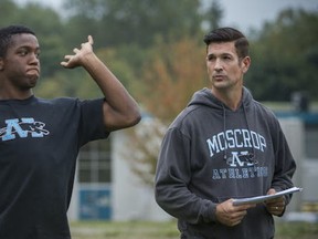 Moscrop Panthers head coach Craig Bymoen keeps a close eye on senior quarterback Abdinasir Abdi during Tuesday practice in advance of Friday non-conference tilt against Eric Hamber. (Ric Ernst, PNG)