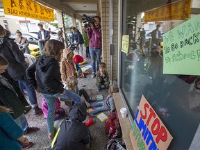 Parents and kids outside MLA Suzanne Anton's office in Vancouver on Tuesday.