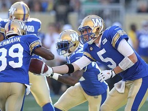 Drew Willy of the Winnipeg Blue Bombers passes to Clarence Denmark during last week's game against the Saskatchewan Roughriders.